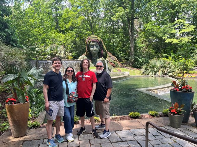 Logan with his family enjoy the botanical gardens in Atlanta, Georgia.